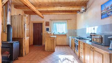 Family House, 2 Bedrooms, Balcony, Mountainside (Chalet With Private Whirlpool And) | Private kitchen | Fridge, microwave, oven, stovetop