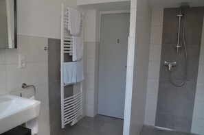 Shower, hair dryer, towels, toilet paper