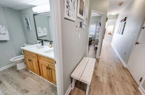 Combined shower/bathtub, hair dryer, towels, toilet paper