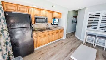 Fridge, microwave, stovetop, coffee/tea maker