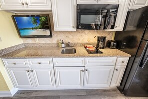 Fridge, microwave, stovetop, coffee/tea maker