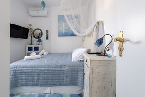 Departamento | 2 habitaciones, tabla de planchar con plancha y cuna de viaje 