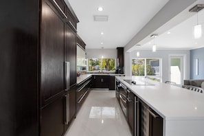 Fridge, microwave, oven, stovetop - Just 10min to downtown Ft. Lauderdale & beach, this modern home offers everything a group could want for an upscale relaxing getaway. Unwind in the very private and peaceful backyard oasis, featuring a heated pool ($), 6-person hot tub & fire pit. (Fort Lauderdale)