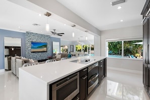 Fridge, microwave, oven, stovetop - Just 10min to downtown Ft. Lauderdale & beach, this modern home offers everything a group could want for an upscale relaxing getaway. Unwind in the very private and peaceful backyard oasis, featuring a heated pool ($), 6-person hot tub & fire pit. (Fort Lauderdale)