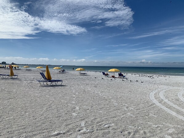 On the beach, sun-loungers, beach towels