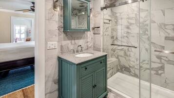 Shower, rainfall showerhead, hair dryer, towels