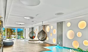 Outdoor pool, an infinity pool, pool loungers