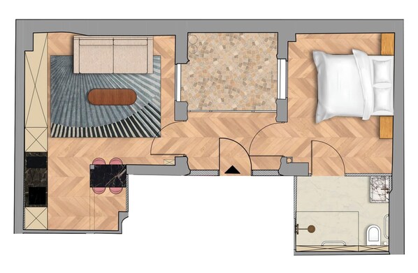 Ein Hotelzimmer mit Bett, Sitzecke und Bad.