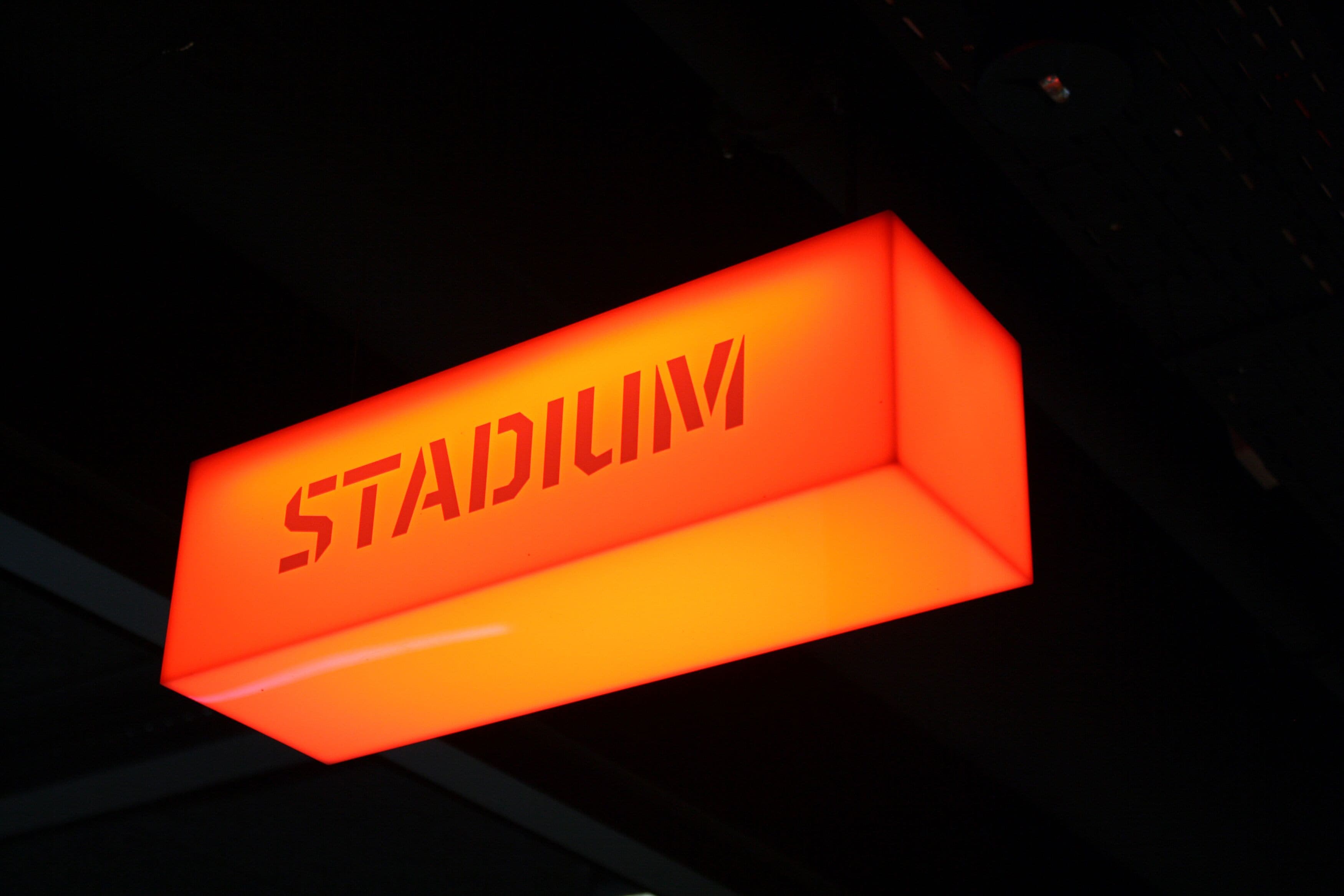 A sign with the word "STADIUM" in bold letters.