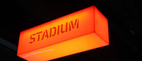 A sign with the word "STADIUM" in bold letters.