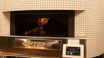 A wood-fired oven with a digital display, branded "MODENA ITALY."