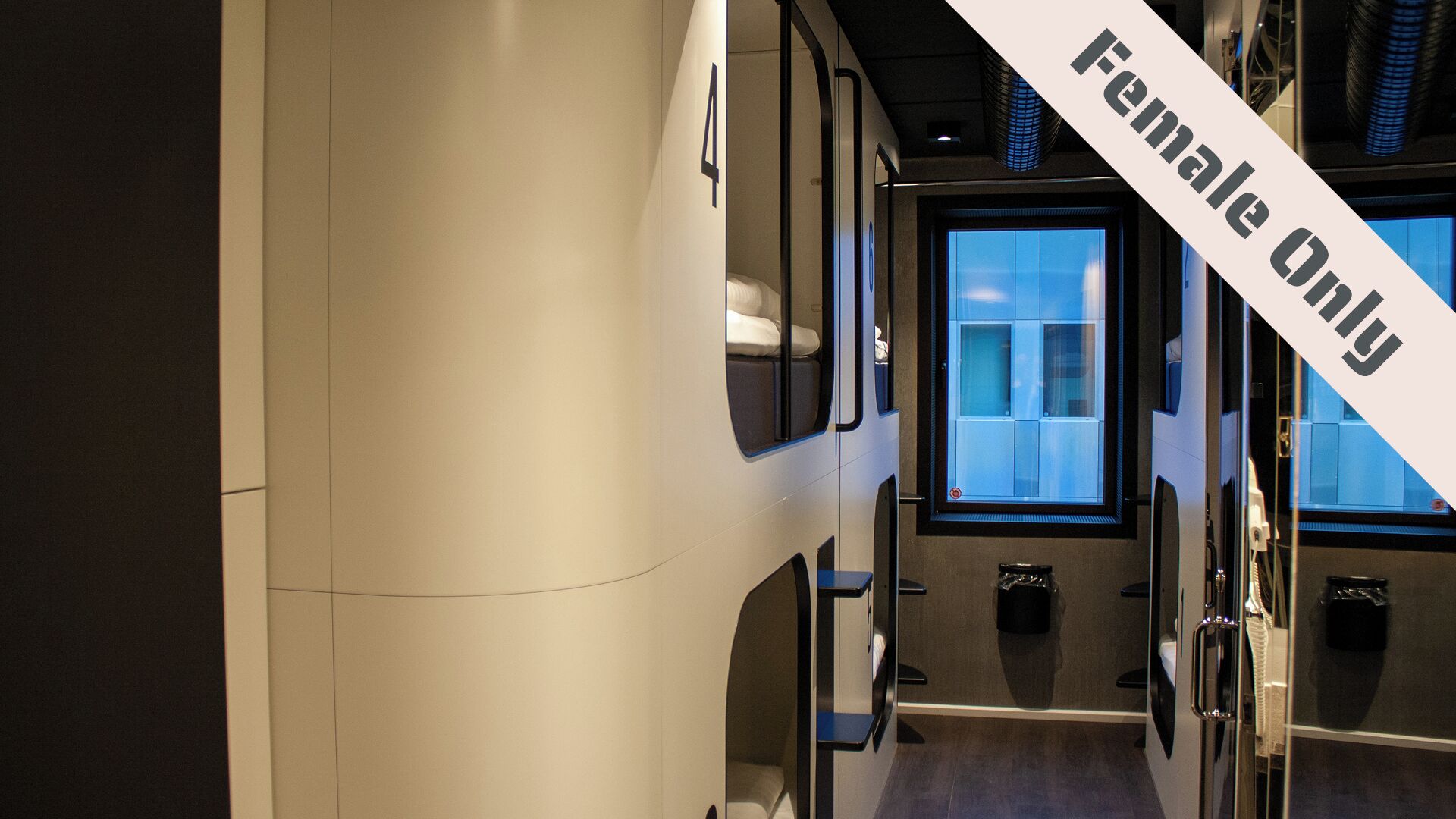A train carriage with a "Female Only" sign, indicating a designated area for female passengers.