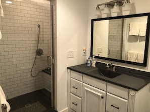 Bathtub, hair dryer, towels, soap