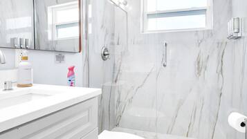Bathtub, hair dryer, towels