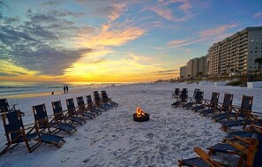 A beach with lounge chairs arranged in a semi-circle around a fire pit, overlooking the ocean and a hotel in the background. - Summer Isn't Over in Miramar Beach-Sleeps 14
SNOWBIRD 30,60,90 day reduced rates (Miramar Beach)