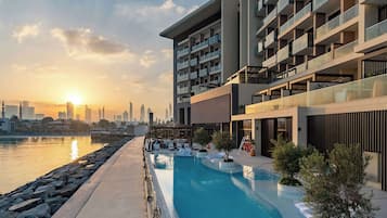 Outdoor pool, open 8:30 AM to 8:00 PM, pool loungers