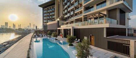 Outdoor pool, open 8:30 AM to 8:00 PM, pool loungers