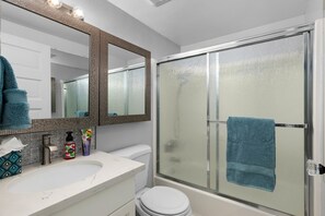 Combined shower/tub, hair dryer, towels, soap