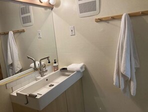 Shower, towels, soap, shampoo