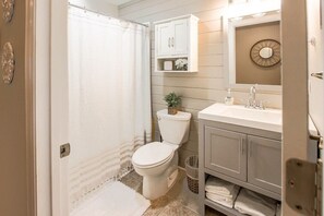 Bathtub, hair dryer, towels