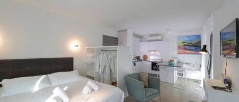 Iron/ironing board, travel crib, free WiFi, bed sheets