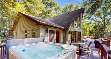 Lake-view home with hot tub, dock, decks, firepit, & AC - near slopes, dogs OK