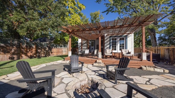 A patio with stone flooring, outdoor furniture, and a fire pit. - Peak House Hot Tub 3BR 2.5BA Close to Downtown  (Boise)