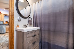 Combined shower/tub, hair dryer, towels, soap