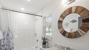 Combined shower/tub, hair dryer, towels, soap