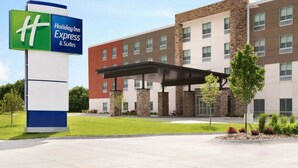 A Holiday Inn Express & Suites building with a modern design, featuring a covered entrance and a landscaped front yard. - Holiday Inn Express & Suites Canton by IHG (Canton)
