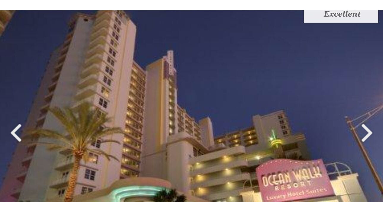 A high-rise hotel with multiple balconies and a sign for Ocean Walk Resort.
