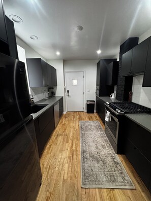 Fridge, microwave, oven, stovetop - Modern 3BR/2.5BA row home in the heart of Lawrenceville with off-street parking. (Pittsburgh)