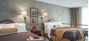 A hotel room with two beds, a nightstand with a lamp, a framed picture, and a window with curtains. - Iron Blosam Week 50 (Sandy)