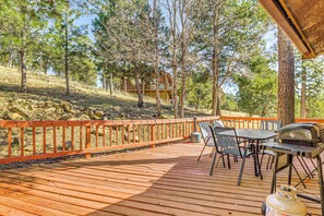 A wooden deck with outdoor furniture, a grill, and a propane tank. - Quiet Ruidoso Getaway ~ 18 Mi to Ski Apache! (Ruidoso)