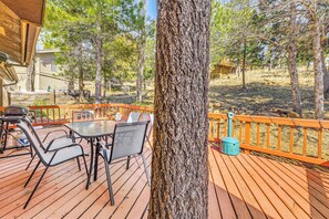 A wooden deck with outdoor furniture, a tree, and a view of the surrounding landscape. - Quiet Ruidoso Getaway ~ 18 Mi to Ski Apache! (Ruidoso)