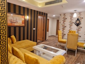 Relax in this stylish living room with a sofa, armchair, and coffee table.