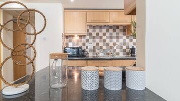 Apartamento clássico, suíte, vista para a cidade | Cozinha compartilhada