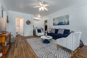 Smart TV, fireplace, books, stereo