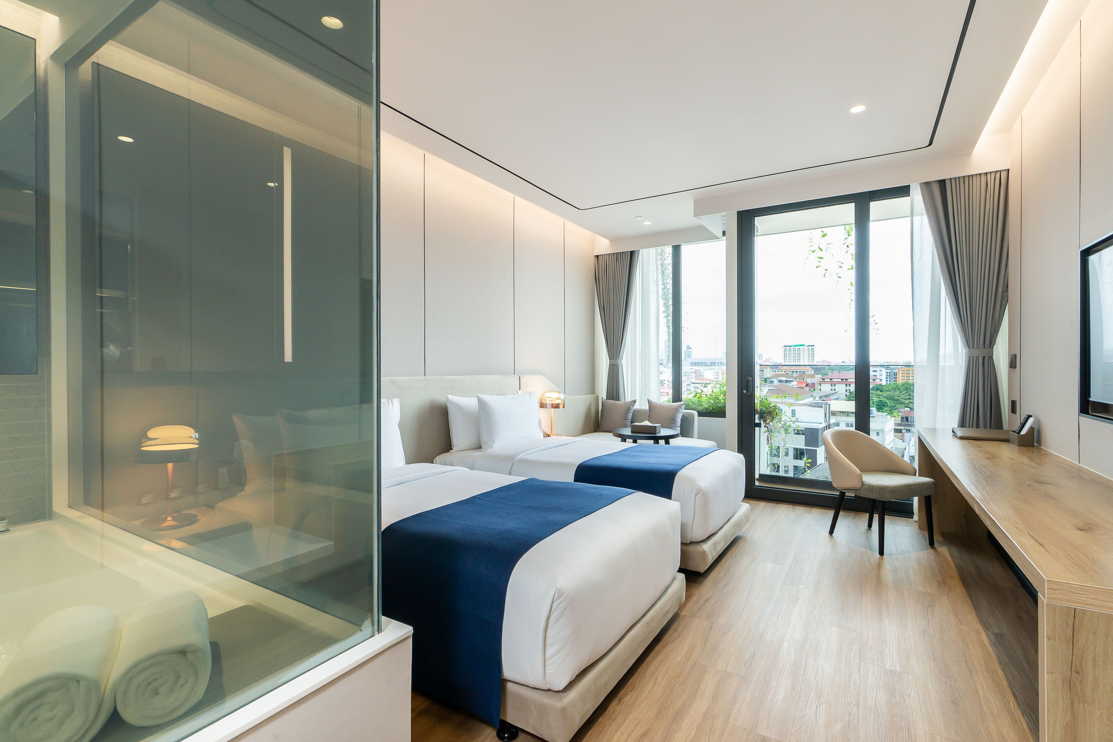 deluxe double or twin room | living area | 49-inch smart tv with digital channels, tv, fireplace