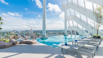 Outdoor pool, open 7:00 AM to 9:00 PM, pool umbrellas, pool loungers