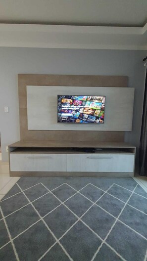 Family Apartment | Living area | 42-inch Smart TV with digital channels, TV, Netflix