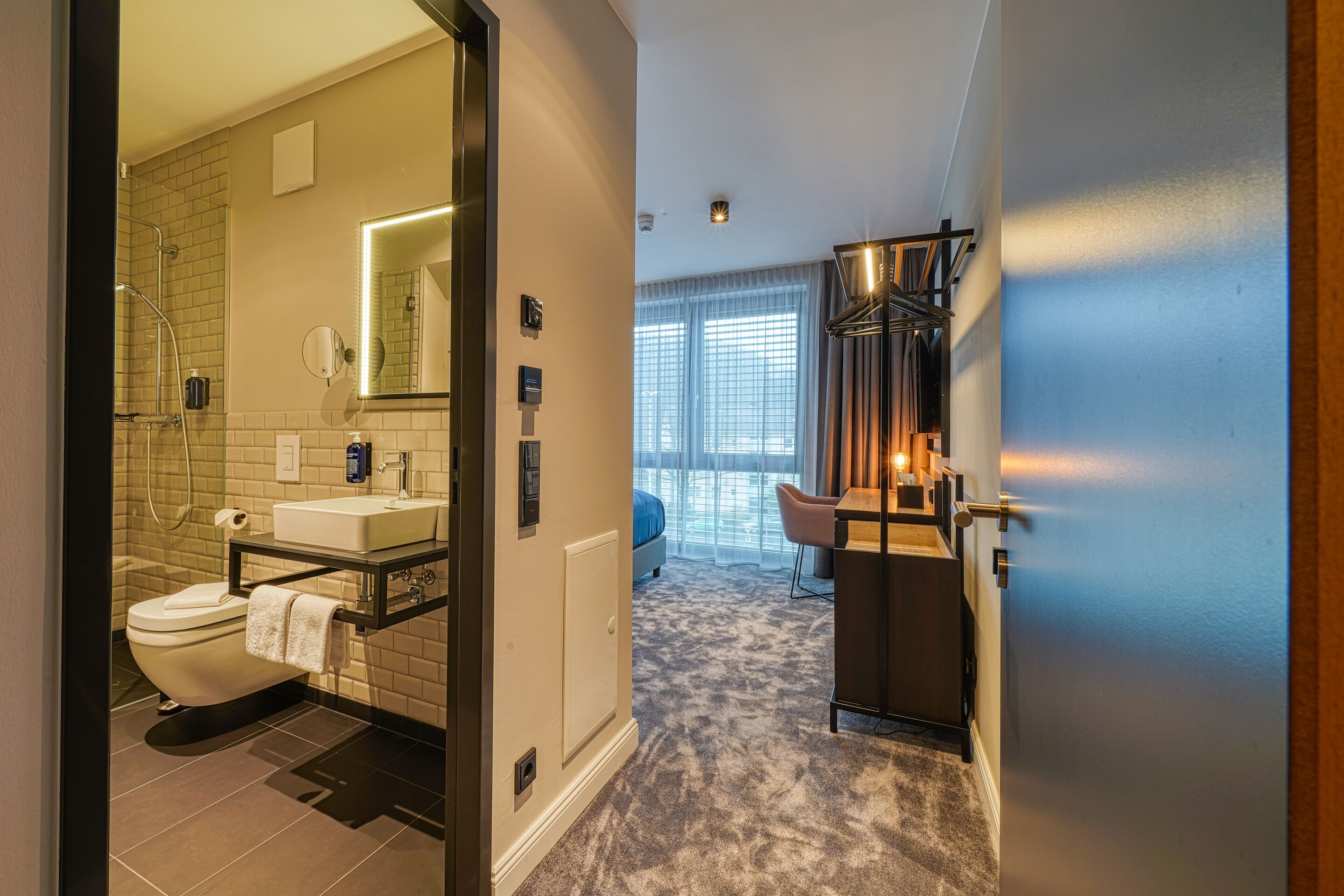 shower, rainfall showerhead, hair dryer, towels