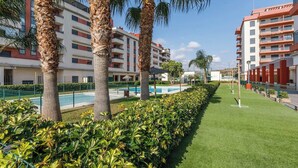 A modern hotel with multiple floors, a swimming pool, and well-maintained greenery. - A&N La Vega 6, (Torre del Mar)