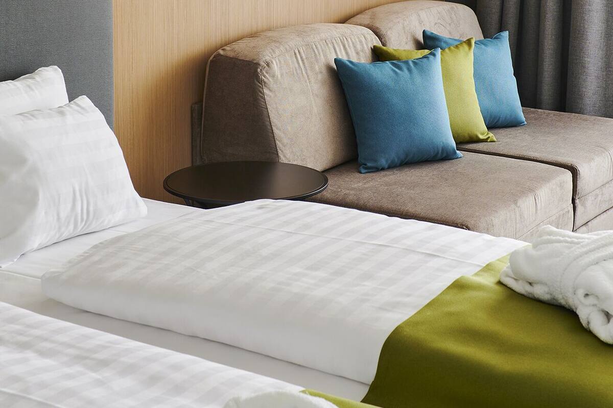 premium bedding, pillow-top beds, desk, blackout curtains