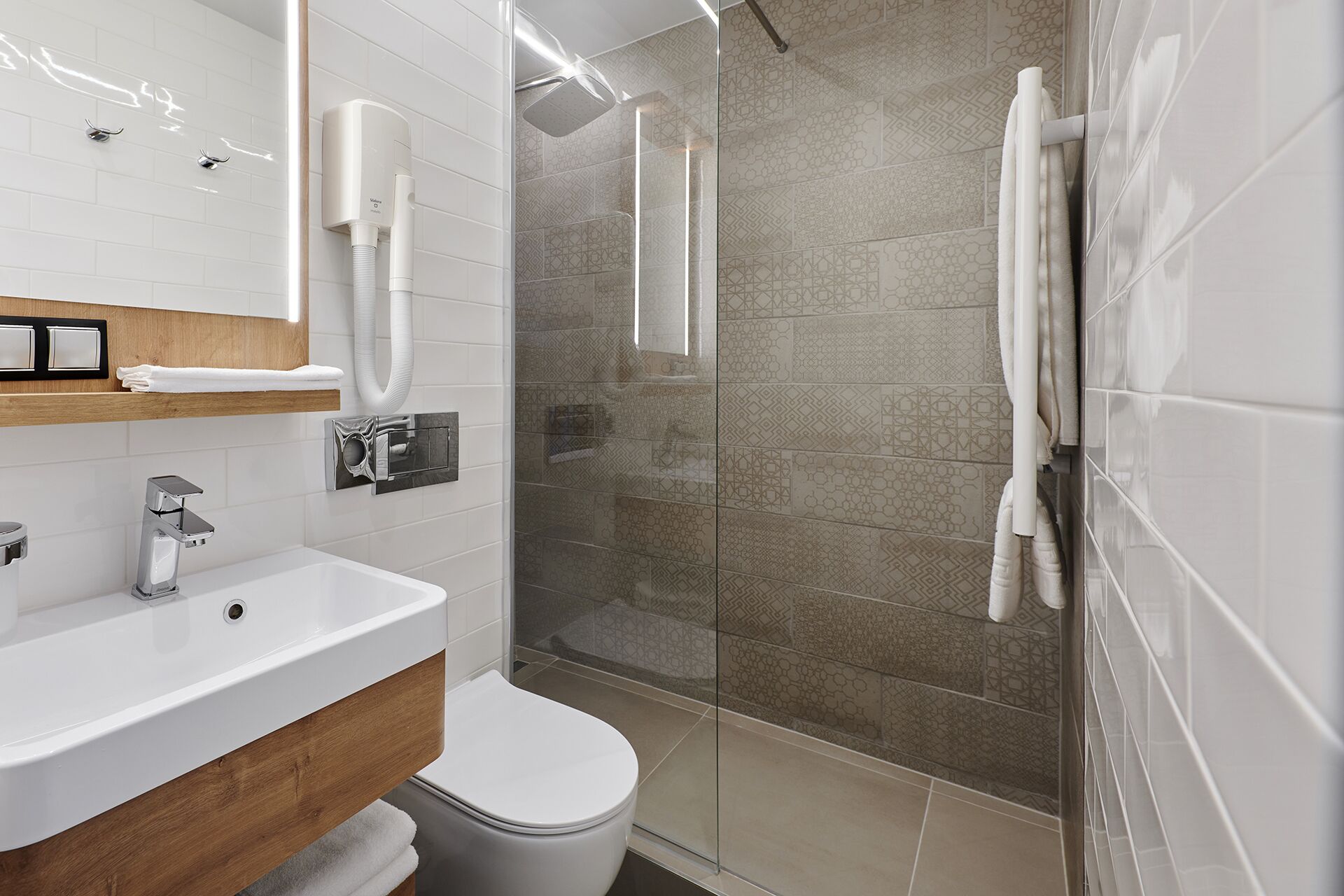 shower, rainfall showerhead, hair dryer, towels