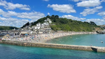 On the beach, sun-loungers, beach towels