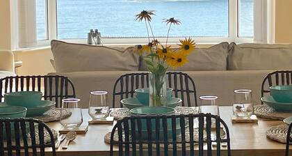 Sea front house.Stunning views, Dog friendly, 100m to beach, Hot Tub.EV Charger