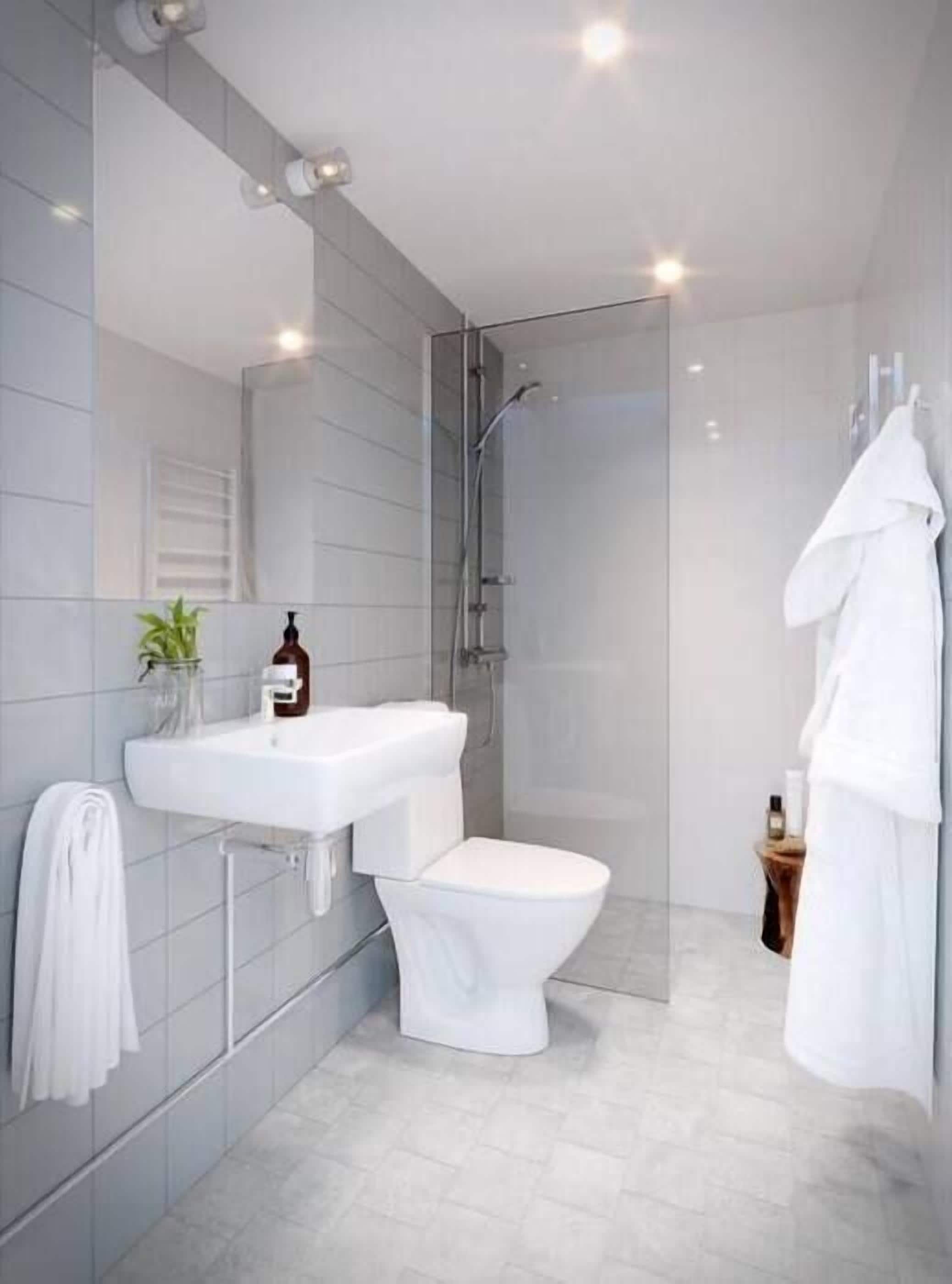 comfort apartment, 1 queen bed | bathroom | shower, hair dryer, heated floors, towels