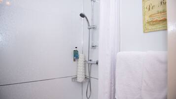 Shower, hair dryer, towels, soap