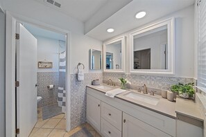 Shower, hair dryer, towels, toilet paper
